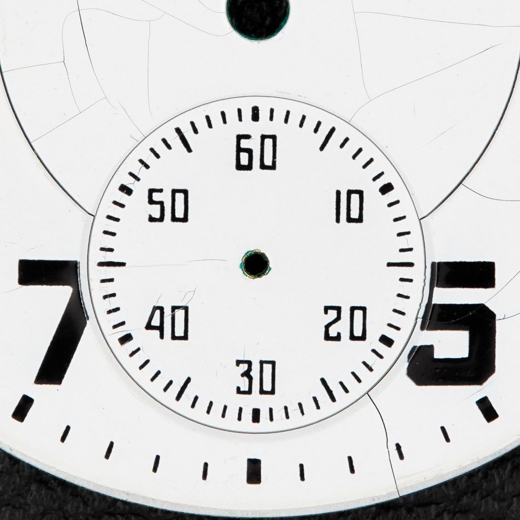 Pictured: Closeup of Hamilton Watch Company Melamine Dial Showing Cracks, c.1952.