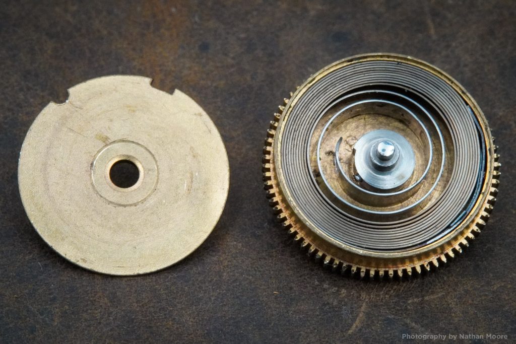 Pocket Watch Mainspring coiled inside mainspring barrel